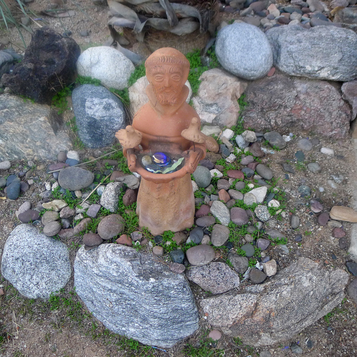 Saint Francis holding stones